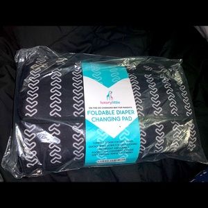 Portable foldable diaper changing pad